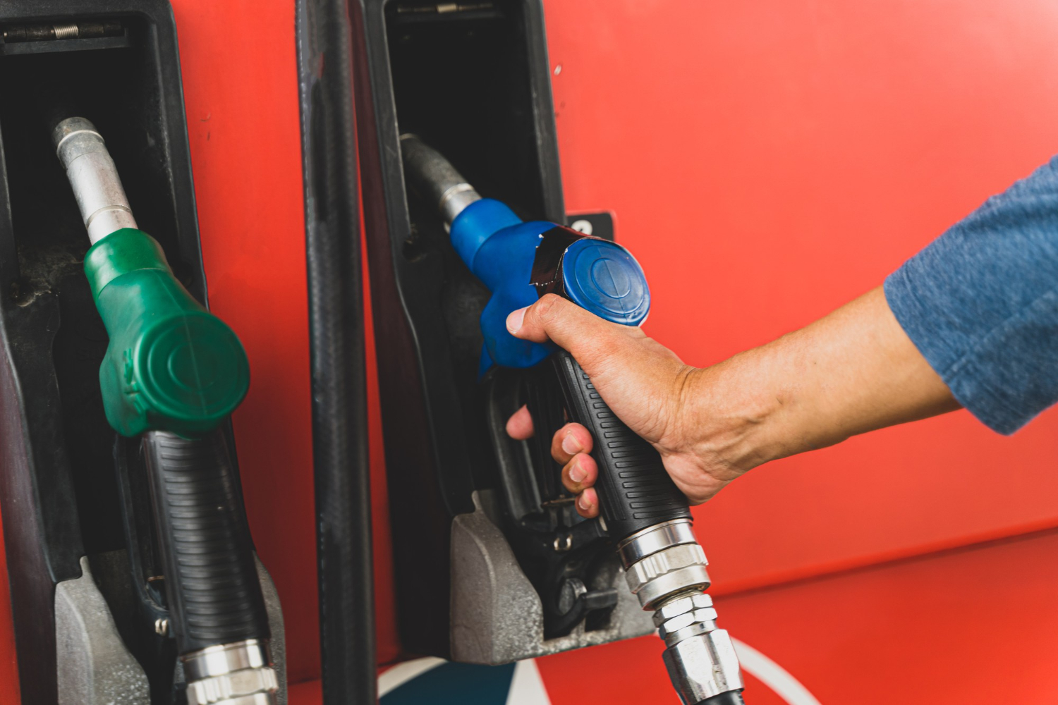 hand-holding-fuel-dispenser-gasoline-pump-concept-transportation-fuel-gasoline-oil.jpg